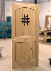 Interior knotty lader doors with speakeasy and iron grill