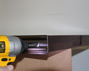 wood door sweep installation with flange head screws